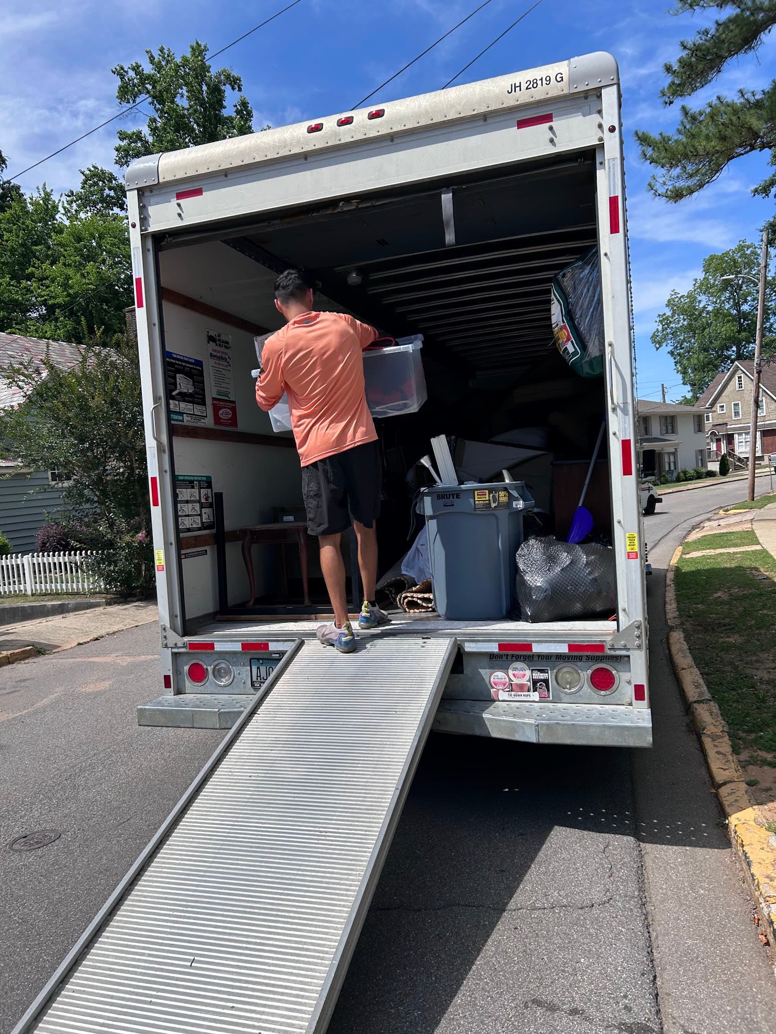 Haul Tide crew loading junk onto the truck in Tuscaloosa